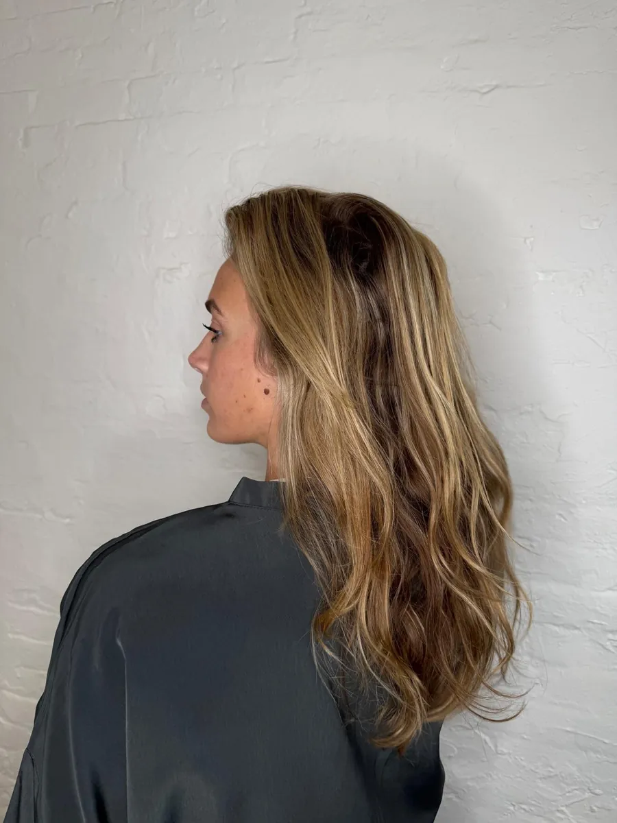 Grown-out blonde before an organic color refresh at Williamsburg Salon