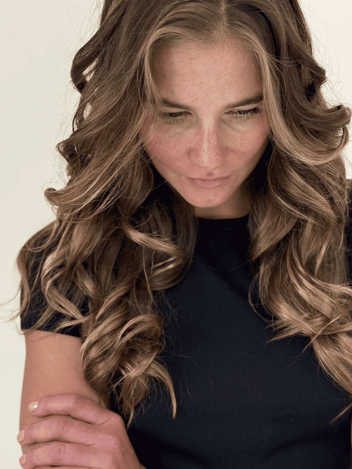Honey blonde balayage on long bouncy curls, Williamsburg Salon