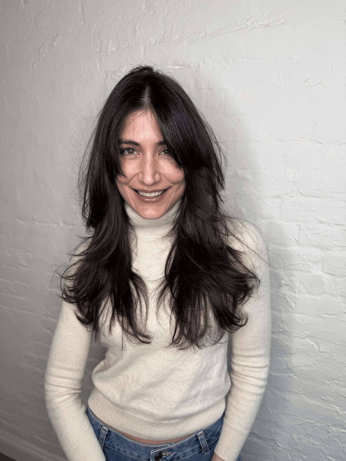 Sleek long black hair with a centre part, Williamsburg Salon