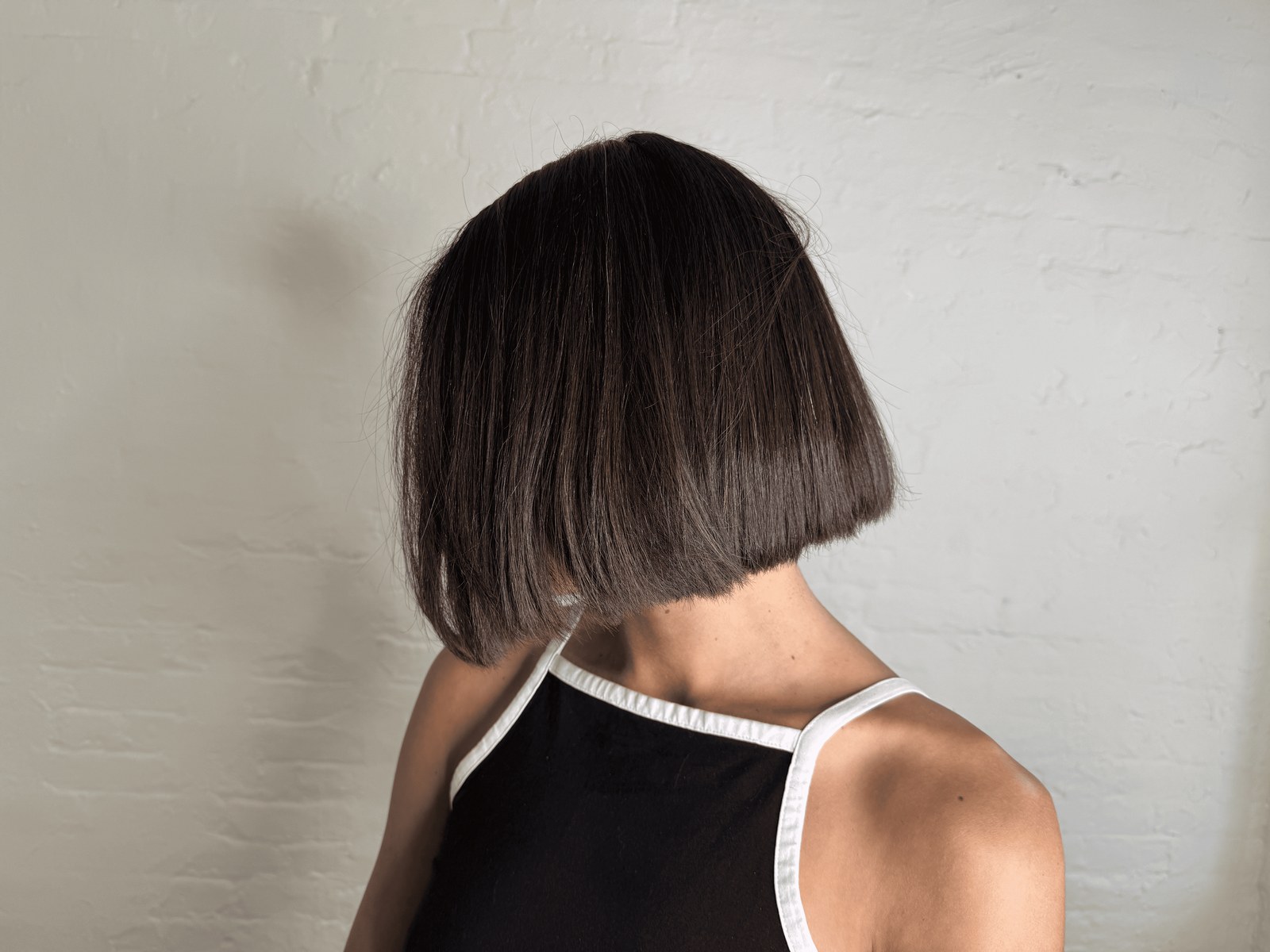 Women's blunt bob finished at the nape, back view, Williamsburg Salon