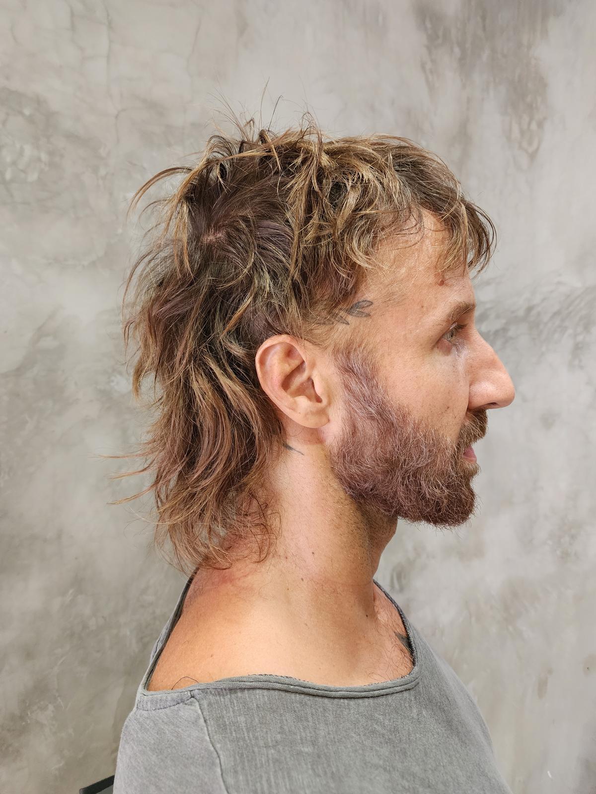 Men's precision haircut with textured length on top, finished at Williamsburg Salon